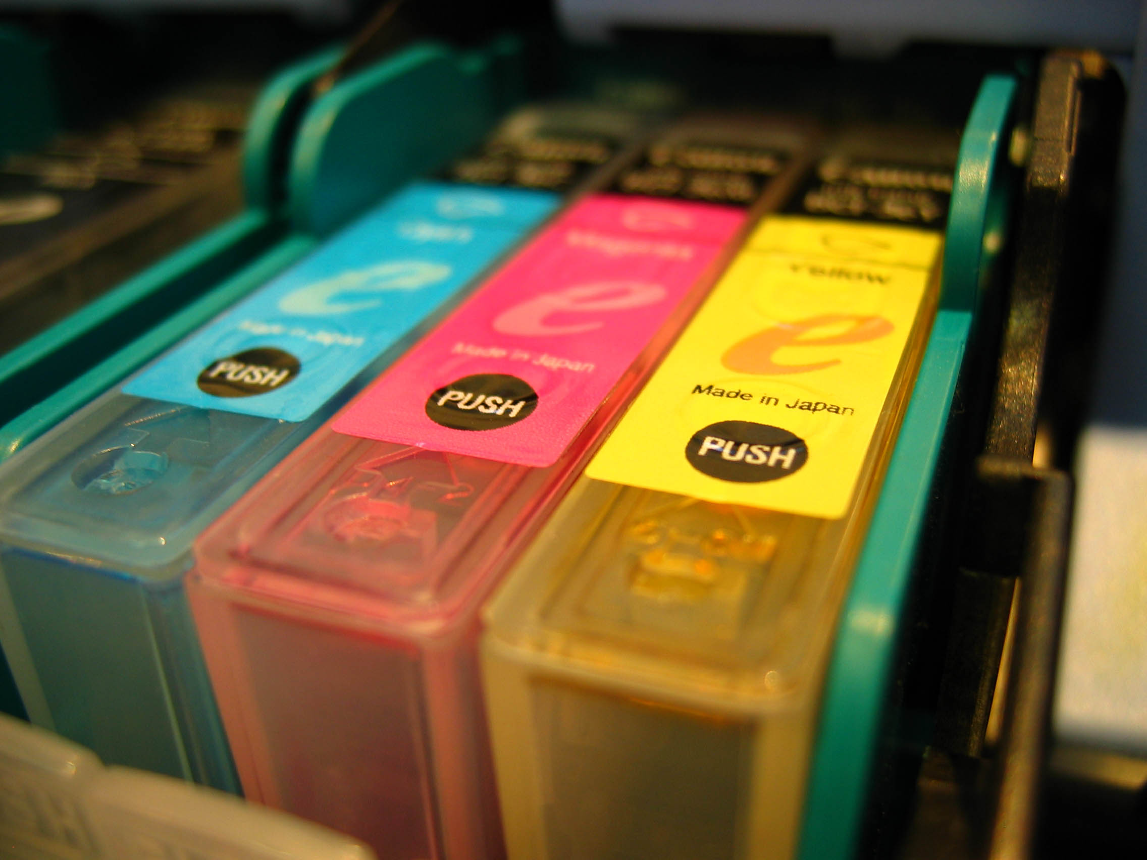 Image of 3 printer cartridges: cyan, magenta and yellow